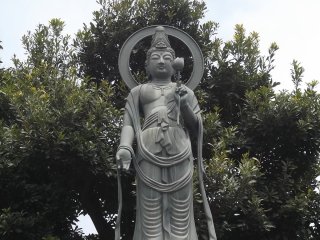 A Buddhist statue in the graveyard