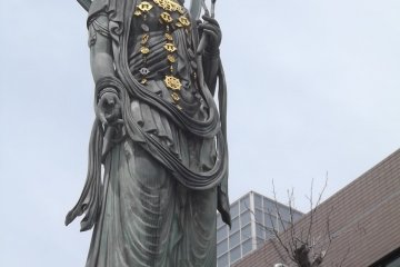 The tall, imposing statue of the Kannon