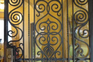 A beautiful iron gate greets visitors at the entrance
