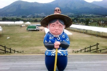 Farmer Obasan keeps watch at the Farmers Co op Market in Dekopon Country between Kumamoto Airport and Mount Aso or Aso san