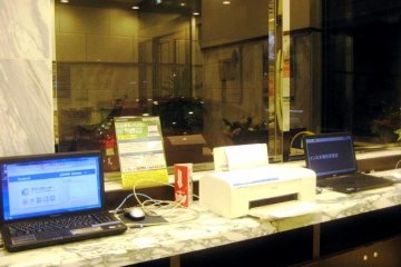 Internet laptops at the lobby of the Toyoko Inn Nihonbashi lets you catch up on facebook or be connected with the world