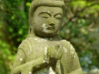 Stone Buddhist statue in the garden