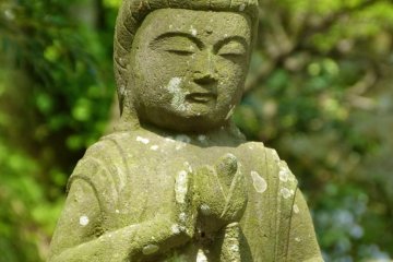 Stone Buddhist statue in the garden