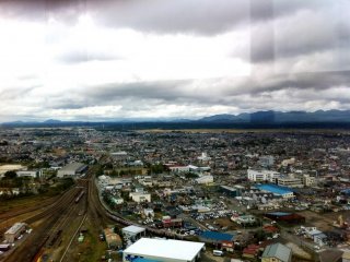 From Akita Selion Port Tower Looking East over the rail yards where freight trains bring in the bountiful rice harvests towards the mountains