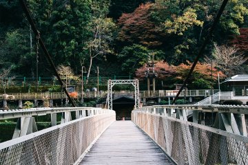 A narrow bridge leading to Hozukyo torokko station, Saga Scenic Railway 