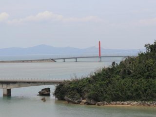 The Yakena Staits narrow passage only accomodates small recreational vessels; the bridge that connects Okinawa to neighboring Henza, Hamahiga, Miyagi and Ikei Islands is seen in the distance