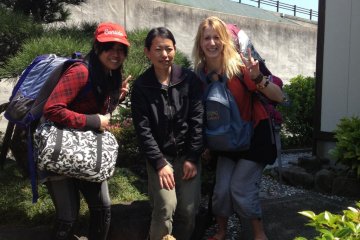 Outside the guesthouse with Shiori-san (centre), the owner.