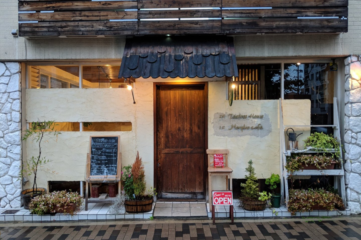 The exterior of Morpho Cafe - warm, charming and inviting.