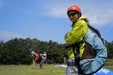 My friend Isao wearing his harnesses and waiting his turn for a practice run down the hill.