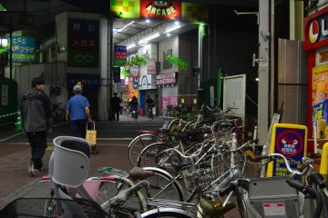 <p>Bicyles in the foreground backed by the Keikyu line above</p>