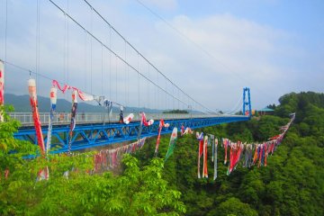 Brilliantly blue Ryujin Bridge with carp streamers