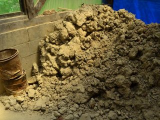 Excavated clay raw materials awaiting processing.