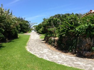 Toguchi Beach Park's paved pathways go up and down the limestone bluffs as well as along the shoreline