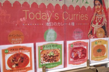 A sign outside tells you the day's curries