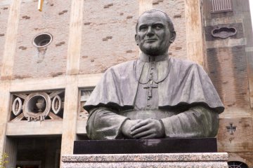 A bronze statue of Pope John Paul II is on display near the entrance to the Cathedral