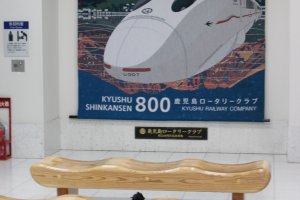 The seating area outside of the Shinkansen platforms is located right next to Satsuma Bar.