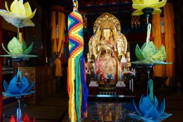 Colorful displays brighten up a dark room in the temple