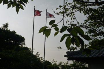 Both flags seen from the monument