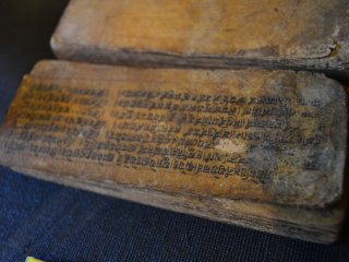 Holy book made from bark that is written in Nepalese characters.
