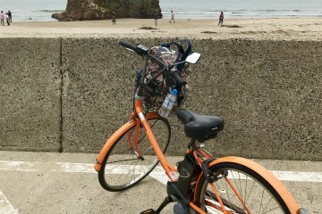 Bright orange bicycles are available for rent at Izumo Taisha Mae Station