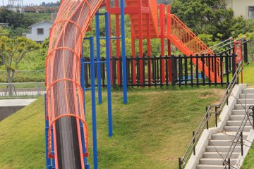 <p>This red giant slide is fast; it&#39;s made of dozens and dozens of connected 2 meter long composite panels</p>