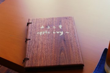 The menu is all in Japanese written on this stylish wooden menu