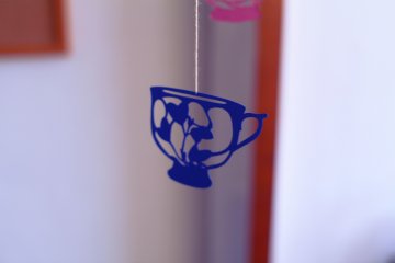 Handmade mobiles of the cafe's vintage teacups