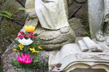 These Jizo statues are used as memorials for children who have passed away