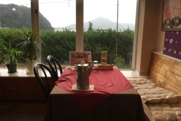 The coziest corner of the restaurant with a view of the sea and the hills.