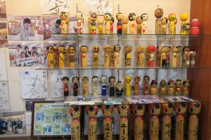 Kokeshi painted by famous people on display