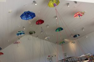 A small display of umbrellas with different motifs in the Metsa Hall