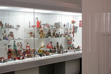 A collection of regional dolls and toys