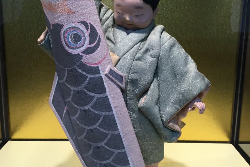 Dolls depicting ordinary people are also on display.