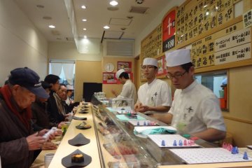 A shop full of happy customers. This sushi is good!