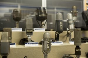 A collection of microphones shows the development in audio equipment over the years