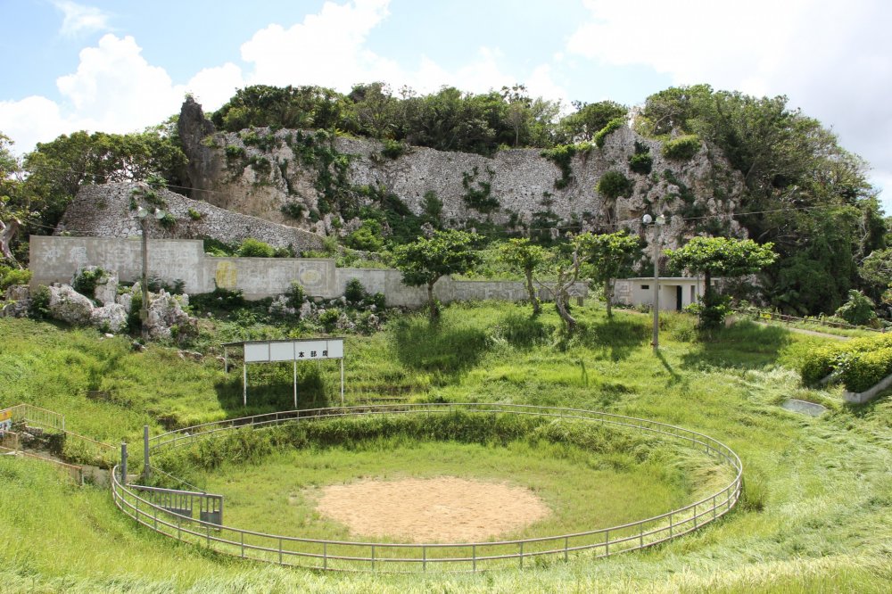 The bullfighting arena is back dropped by the Agena Castle Ruins