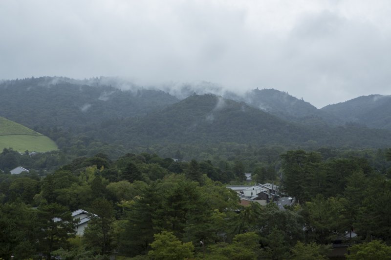 Mist rolls down the mountains towards the city of Nara