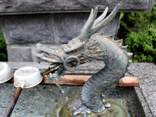 Metal dragon at an ablution well