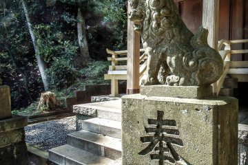 A "Koma-inu" or "Lion-dog" guards the main shrine