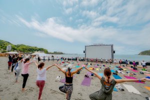 The event includes a variety of fun additional activities, including beach yoga