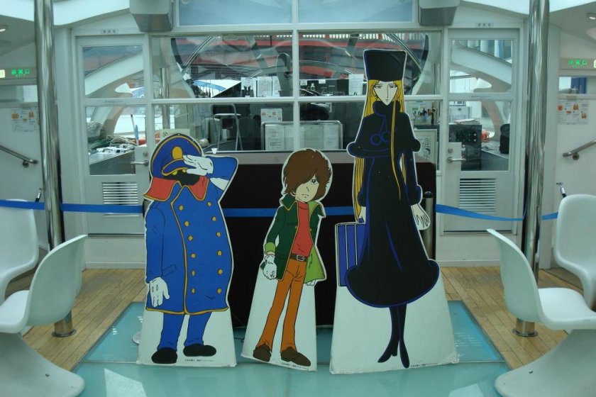 Cutouts of Matsumoto's Galaxy Express 999 characters aboard Himiko.