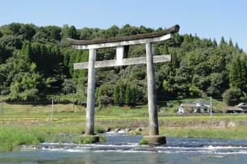 A torii gate just upstream from the falls