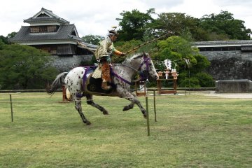 A rider canters between targets