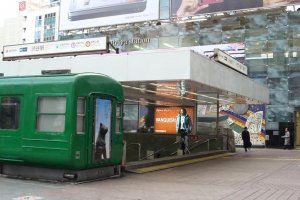 Retro Setagaya Line train car and Tokyo Metro subway entrance.