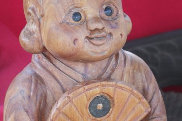 A wooden carving for sale