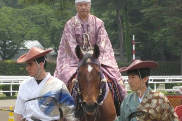 <p>Yabusume is a traditional Japanese event where a man in full regalia gallops on horseback, while shooting an arrow at a target.</p>