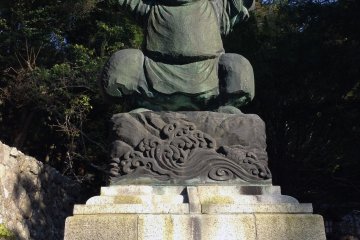 One of the Seven Lucky Gods of Fortune, Ebisu, greets visitors at the top of the hill.
