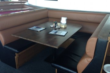 <p>The windows side seats are newer, but the booth tables are uncomfortable to sit at due to wobbly tables and lack of room to breath</p>