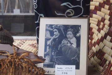 An Ainu mother and her baby in a photography provided by the Kawamura family.