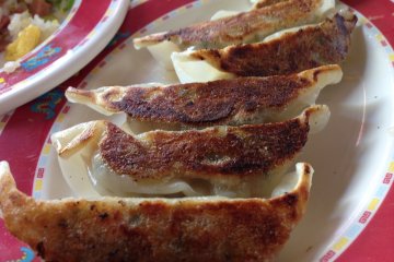 <p>Dragon&#39;s gyoza is distinctly crispy on one side; I like to poke a hole into the tender side with my chop sticks&nbsp;to allow the gyoza sauce to fill the inside of the dumpling</p>